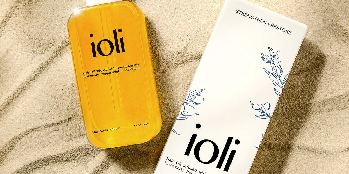 ioli box and bottle on sand