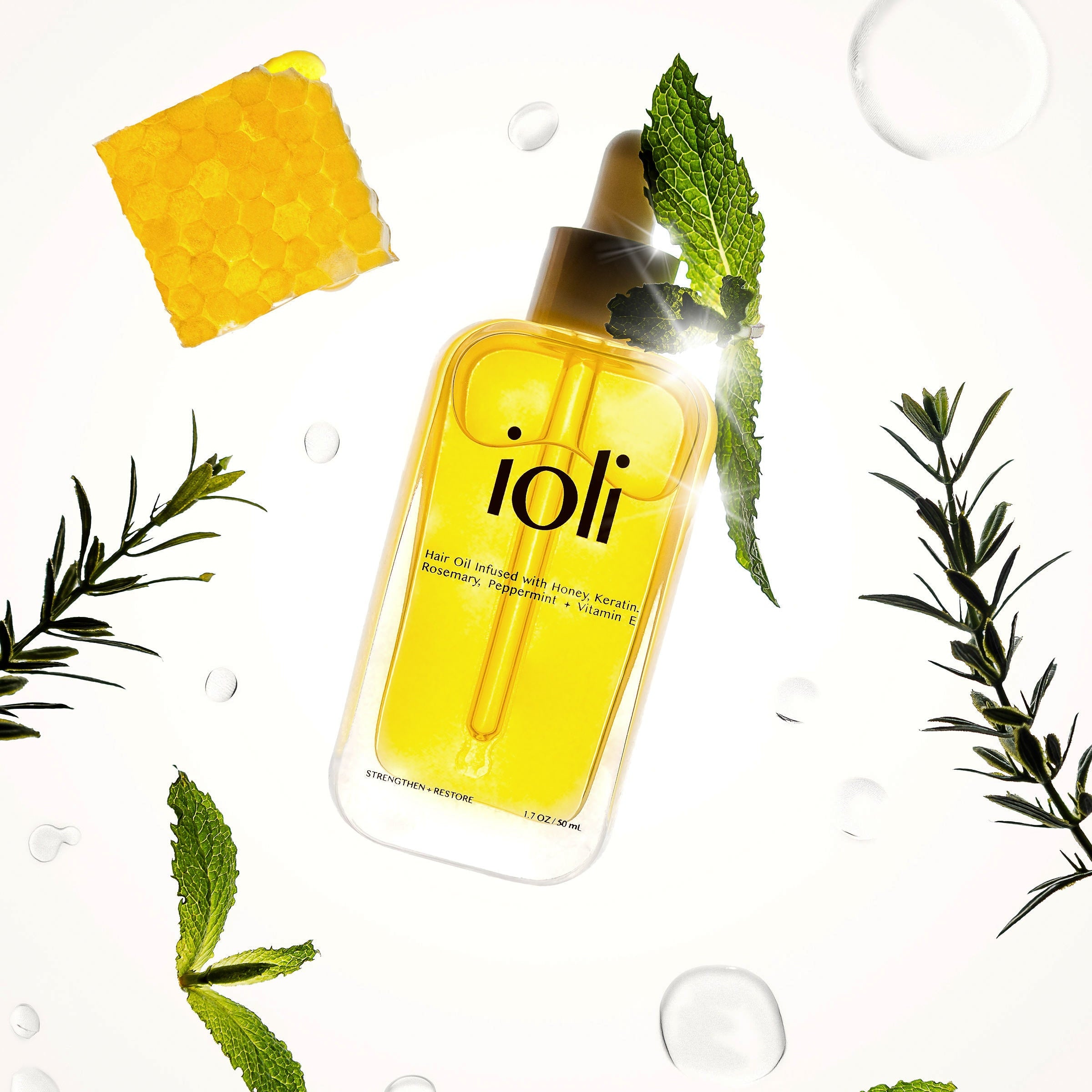 ioli bottle with ingredients on white background